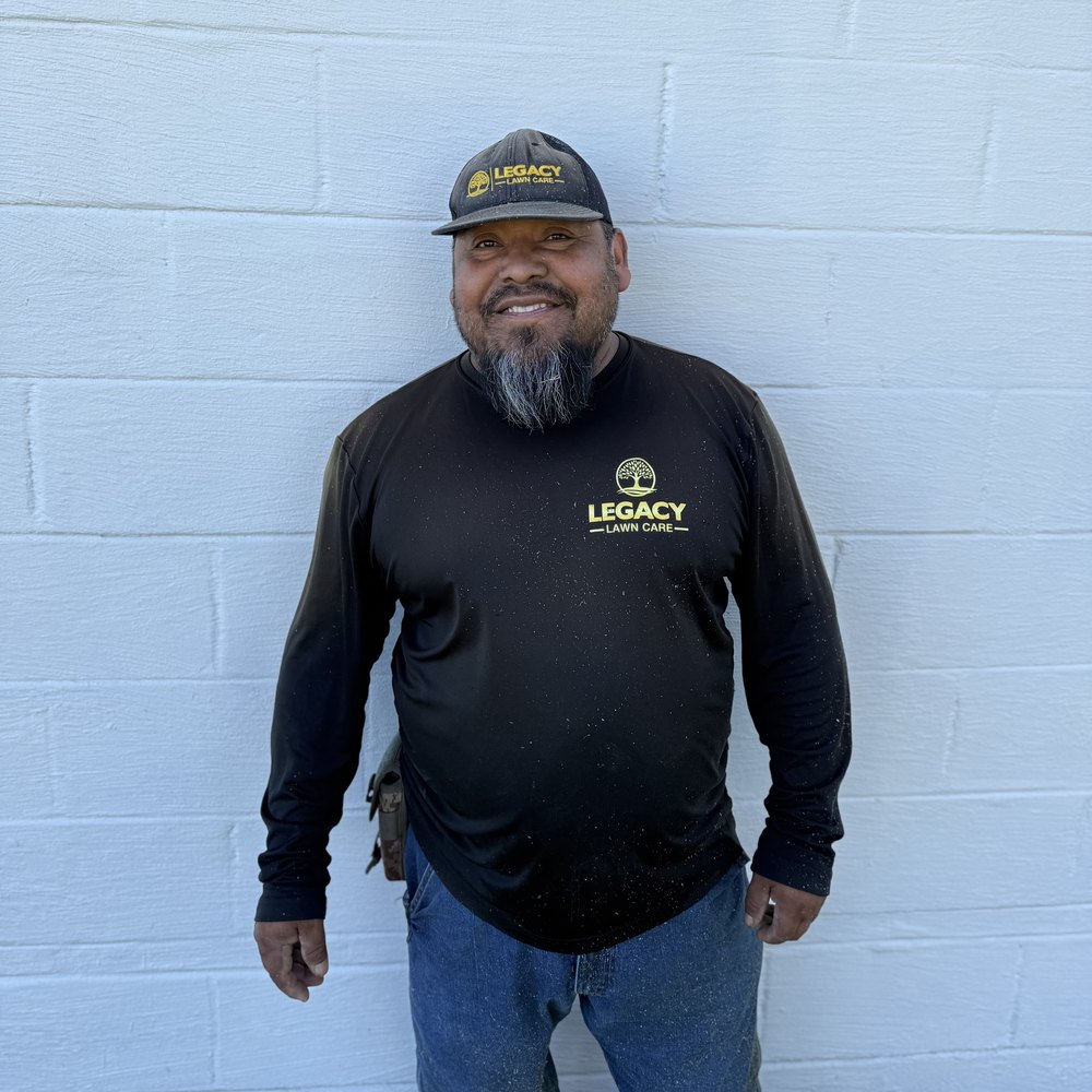 Legacy Lawn Care crew member in uniform